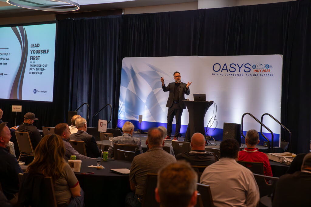 Presenter on stage at a conference